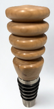Wooden bottle stopper with stacked rings on a white background